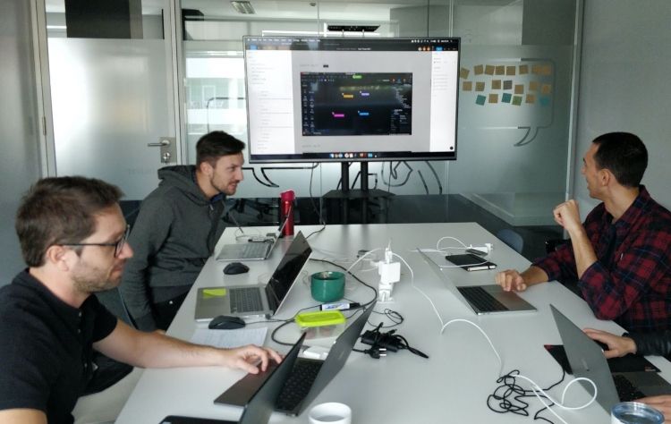 Three members of the UX Team working in the OutSystems office
