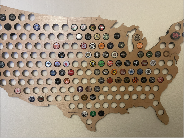 A panel with beer caps on the US map.